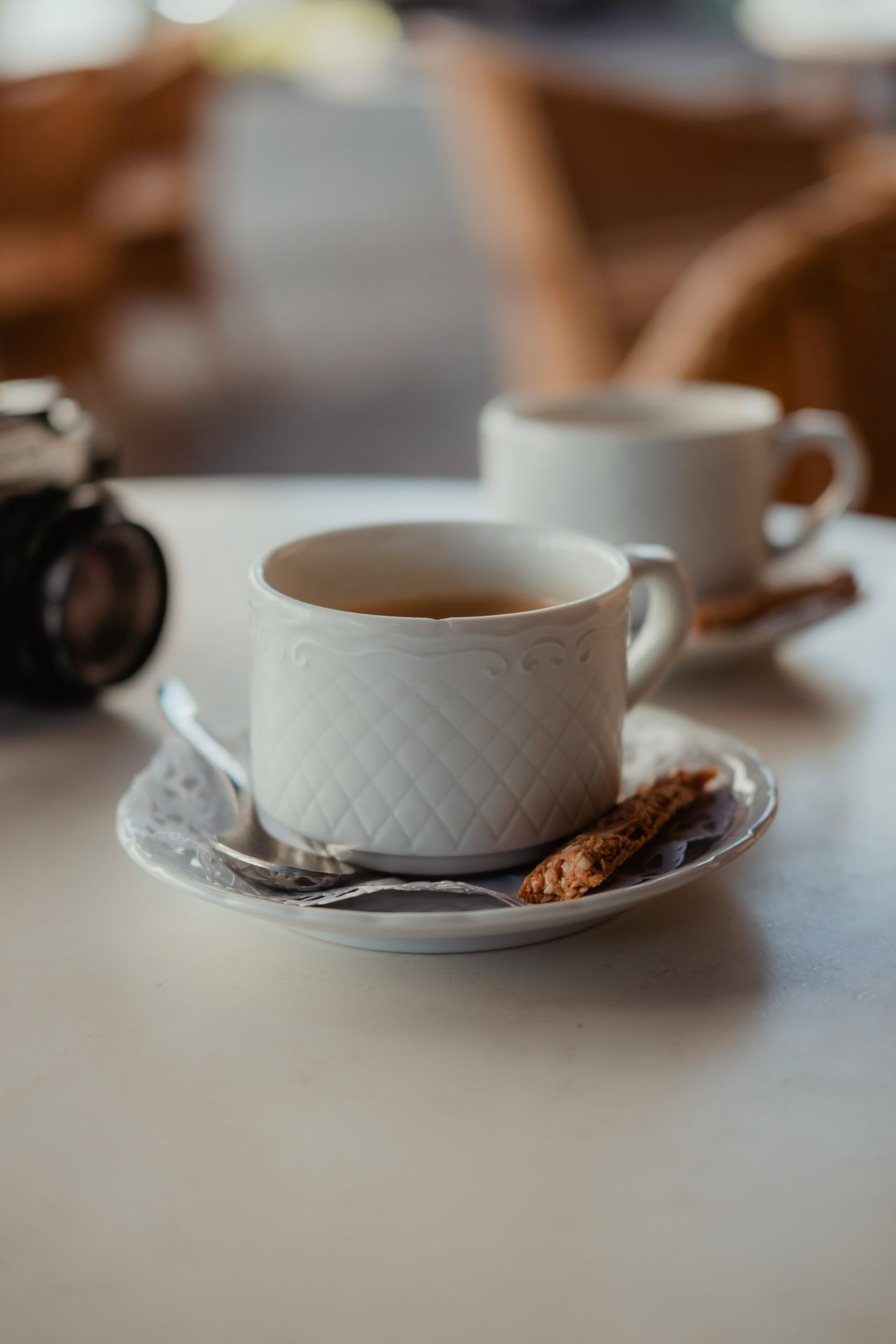 white ceramic mug on saucer